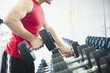 Middle Eastern man exercising with dumbbells
