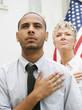 People pledging allegiance in line to vote