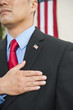 Chinese businessman pledging allegiance to American flag