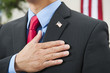 Chinese businessman pledging allegiance to American flag