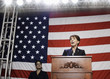 Female politician making speech at podium