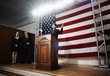 Female politician making speech at podium