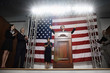 Female politician making speech at podium