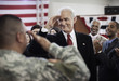 Soldier saluting politician at political gathering