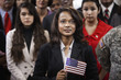 Supporters waving American flags at political gathering