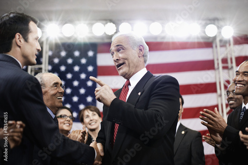 Photo: Caucasian politician talking with supporters Caucasian politician talking with supporters
