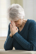 Senior woman praying