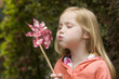 Girl blowing pinwheel
