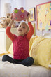 Caucasian girl shaking piggy bank