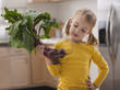 Caucasian girl looking at beets