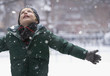 Caucasian boy standing in the snow