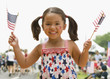 Caucasian girl waving American flags