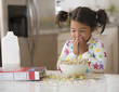 Caucasian girl spilling cereal