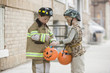 Caucasian boys trick or treating on Halloween