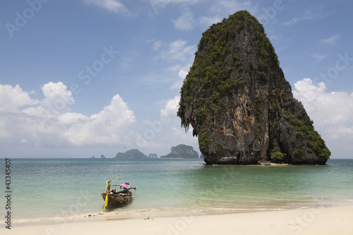Photo: Thai long tail boat on beach Thai long tail boat on beach