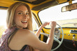 Caucasian woman driving old-fashioned car