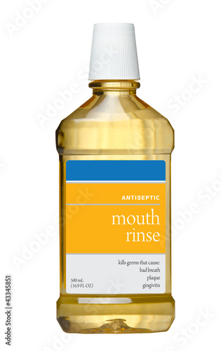 Photo: Plastic bottle of mouthwash isolated on white Plastic bottle of mouthwash isolated on white