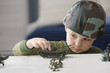 Caucasian boy playing with toy soldiers