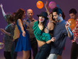 happy young people dancing in night club