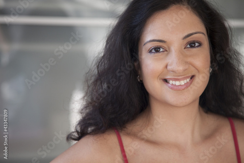 Photo: Smiling mixed race woman Smiling mixed race woman