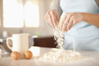 Hispanic woman baking in kitchen