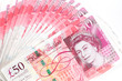 Photo: 50 pound sterling bank notes closeup view business background 50 pound sterling bank notes closeup view business background