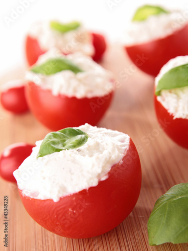 Photo: stuffed tomato with cheese and basil stuffed tomato with cheese and basil