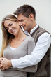 Young Man Embracing Woman