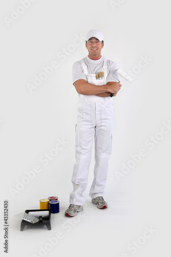 Photo: Full-length portrait of a painter with his tools Full-length portrait of a painter with his tools