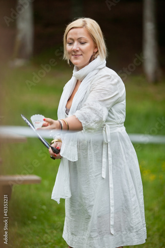 Photo: Woman Playing Badminton In Park Woman Playing Badminton In Park