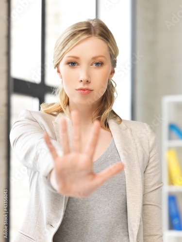 Photo: young woman making stop gesture young woman making stop gesture
