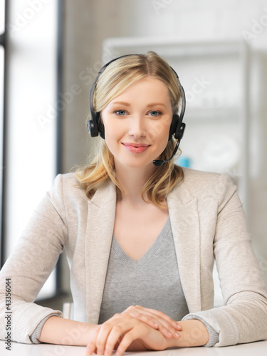 Photo: friendly female helpline operator friendly female helpline operator