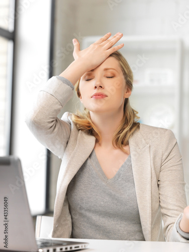 Photo: stressed woman with laptop computer stressed woman with laptop computer