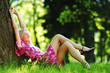 Photo: girl lying under a tree girl lying under a tree