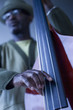 Black musician playing double bass