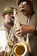 African American musicians playing saxophones together