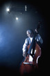 Musician playing double bass on stage