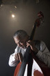 Musician playing double bass on stage