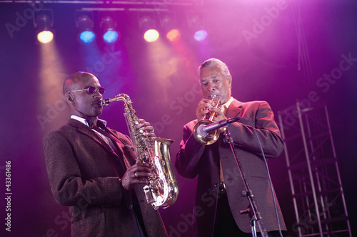 Photo: Musicians playing in jazz band on stage Musicians playing in jazz band on stage