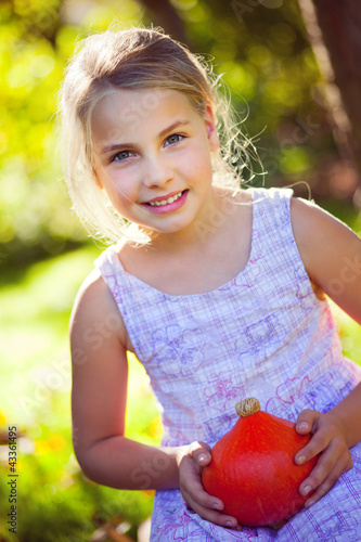 Photo: girl with red kuri squash girl with red kuri squash