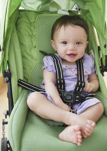 Photo: Mixed race baby sitting in stroller Mixed race baby sitting in stroller