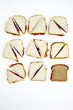 Peanut butter and jelly sandwiches, one on whole wheat bread