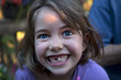 Smiling Caucasian girl with tooth missing