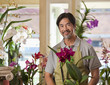 Japanese florist holding exotic flower