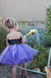 Caucasian girl watering garden