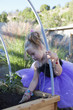 Caucasian girl working in garden