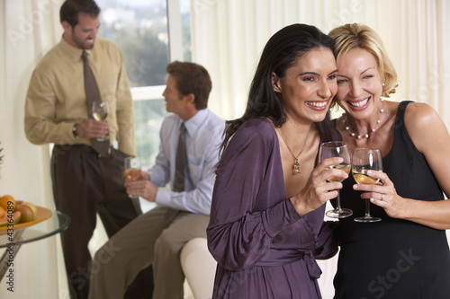 Photo: Smiling couples enjoying party Smiling couples enjoying party