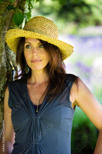 Photo: Beautiful Woman under the shade of a tree Beautiful Woman under the shade of a tree