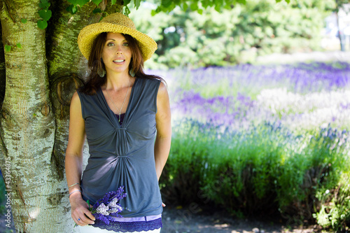 Photo: Beautiful Woman under the shade of a tree Beautiful Woman under the shade of a tree