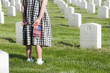 Caucasian girl with flat visiting cemetery
